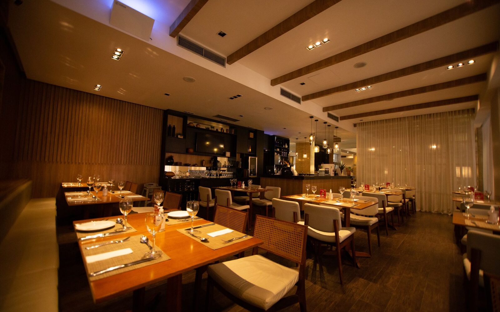 A restaurant dining room set for service, shown on the example site